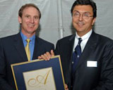 Larry Banack ('75) receives his Arbor Award from U of T President David Naylor