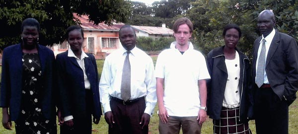 IHRP intern T.J. Riddell with staff from the Legal Aid Project of Uganda