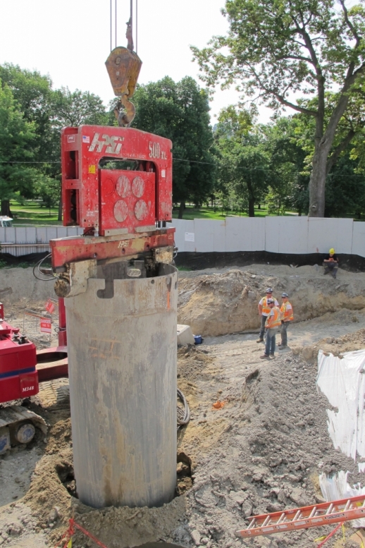 Caisson sleeve being pushed down into ground hole