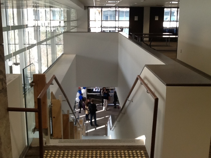 View looking down staircase from law library's second floor