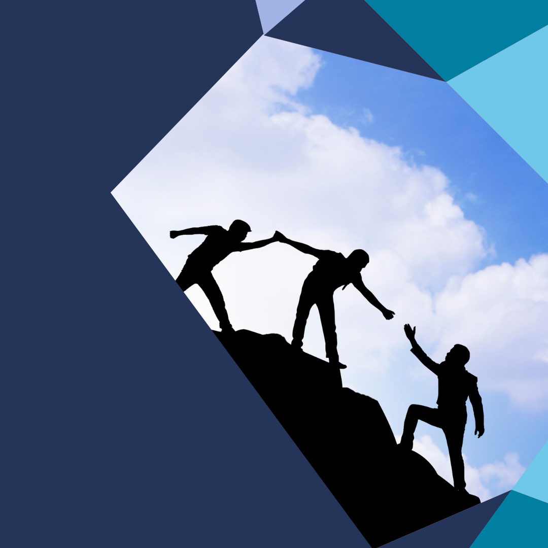 Three people helping one another climb a hillside