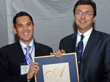 Joseph Cheng (’00) receives his Arbor Award from U of T President David Naylor