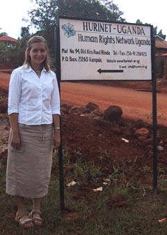 IHRP intern Stephanie Pearce with HURINET sign