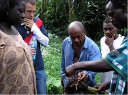 Travis Allan in the field with Bwassa farmers