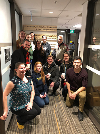 Faculty, students and staff at unveiling of IIO language panels