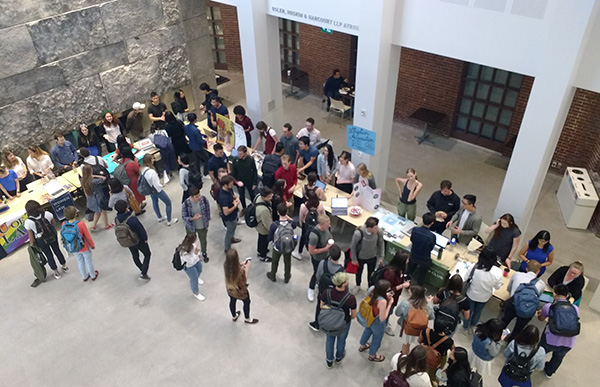 Students at clubs fair in atrium of Jackman Law Building