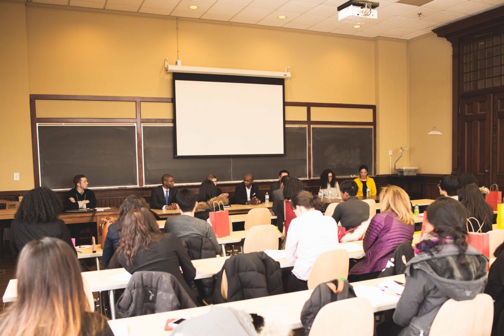 Alumni panel faces group of students in a classroom