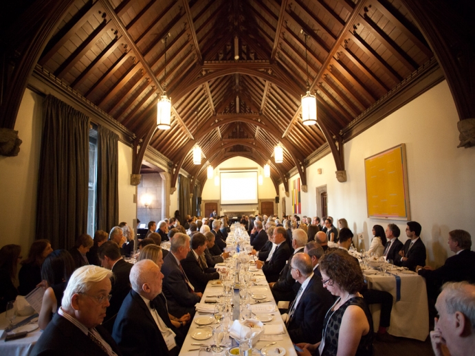 Music room with harvest tables, guests seated for award event