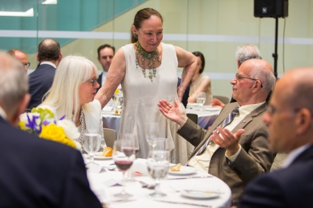 Ann Wilson with Frank Iacobucci at the table, Justice Rosalie Abella standing by them