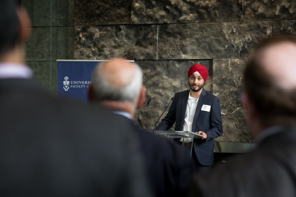 law student Aman Gill at the podium