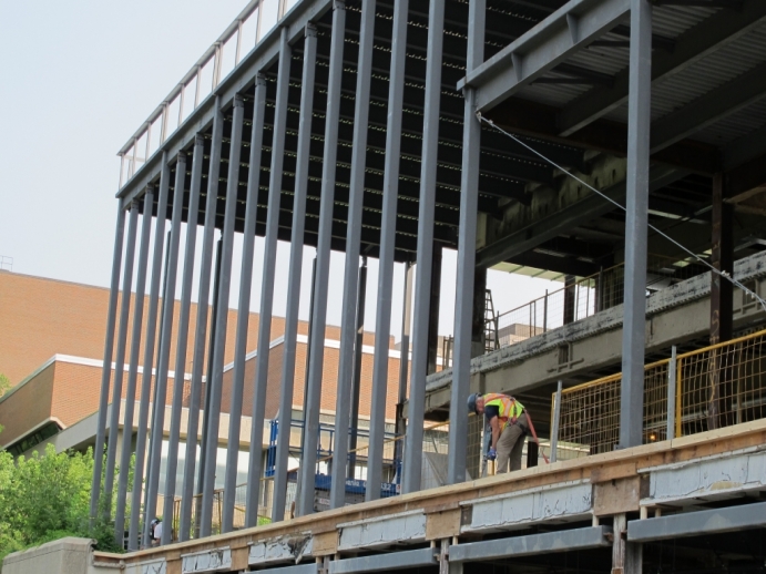 looking up to steel framing of what will be Tory Hall