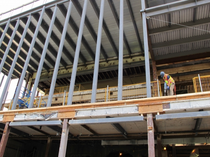 looking up to steel framing of what will be Tory Hall