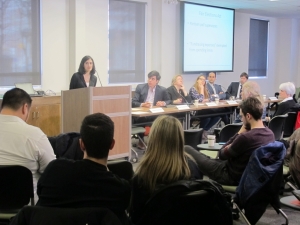 Prof. Yasmin Dawood speaks at podium during panel