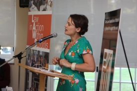 LAWS program director Sarah Pole at a podium