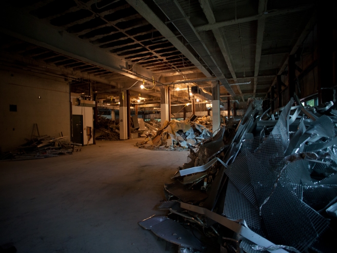 Demolition site with diverted piles of metal beams