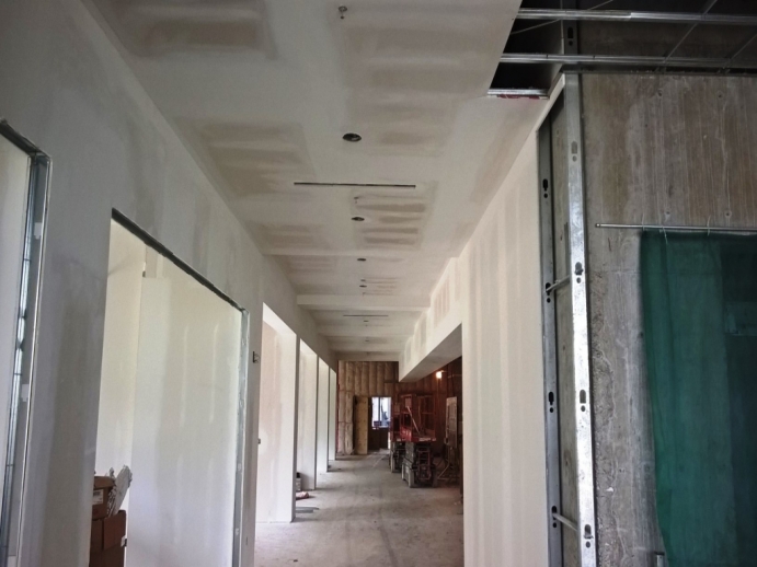 Interior shot of drywalled painted law building during construction