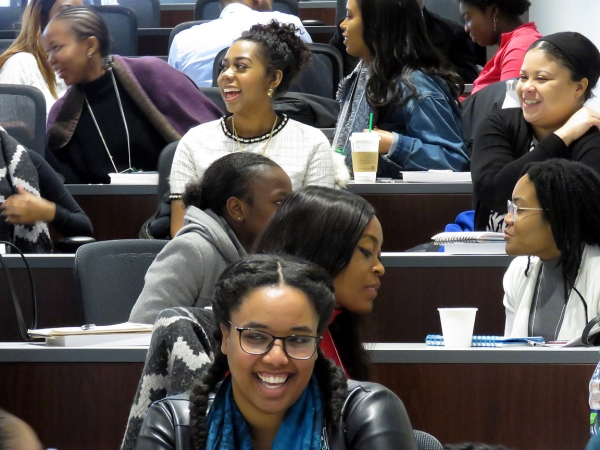 close up of audience laughing and smiling during a conference break