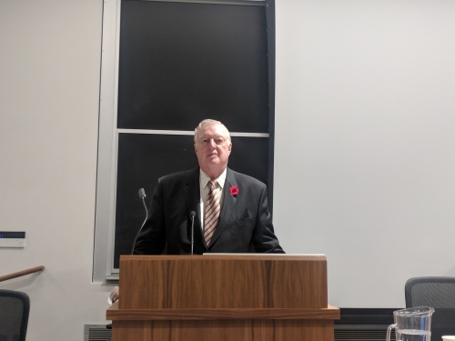 Justice Roger Hughes giving the keynote address at the 7th annual Patent Colloquium
