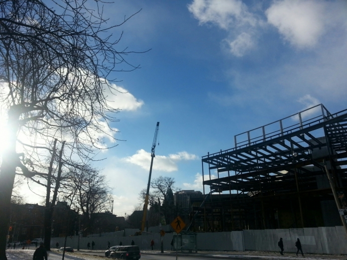 View of west side of Jackman Law Building showing extension of streel framing curving along Queen's Park Crescent