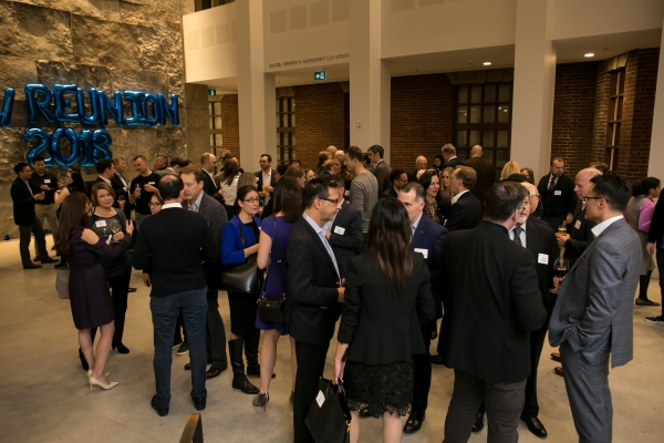 Reunion wide shot of large crowd in the Osler Atrium