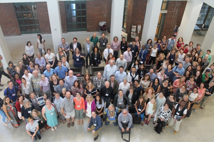 Group shot of conference attendees in the atrium of the Jackman Law Buidling