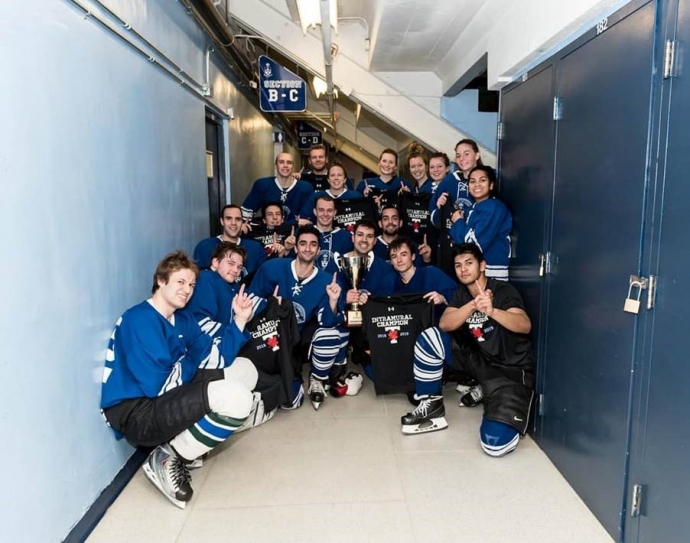 UTLaw won the intramural divisonal coed hockey title, seen here in a group shot at Varsity Arena by the lockers 