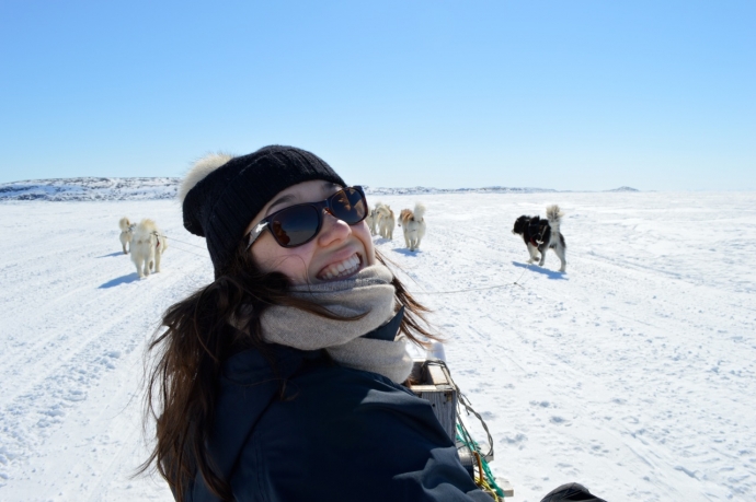 Chloe Boubalos on a dog sled in Nunavut