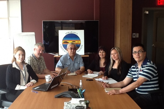 Law student Vanessa Gurr, left, with Industry Relations Corporation staff around a corporate table