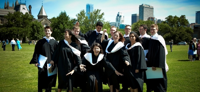 Group of law graduates cheering, smiling