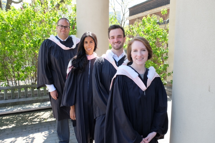 Group of law graduates cheering, smiling