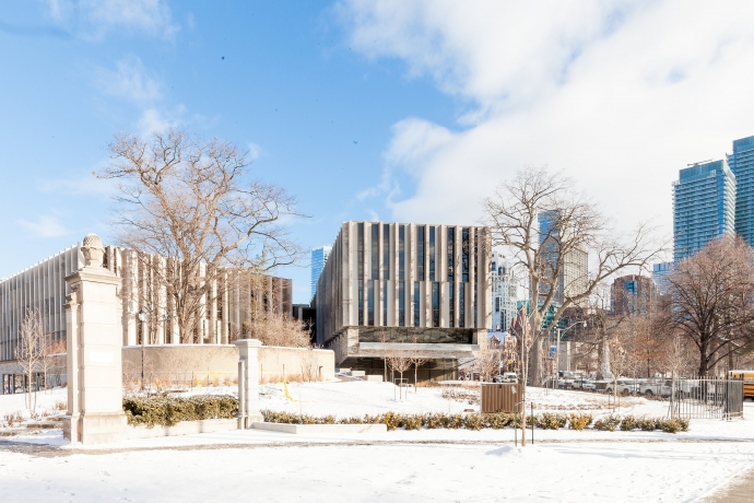 Winter scene of the Faculty of Law's Jackman Law Building looking north from Hoskin Ave. and through the Bennett Gates