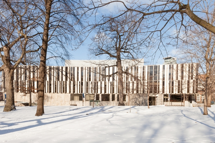 wintry view of the Jackman Law Building from trees in Queen's Park