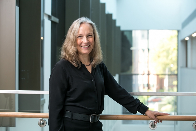 Professor Gillian Hadfield by the student services area in the Jackman Law Building 