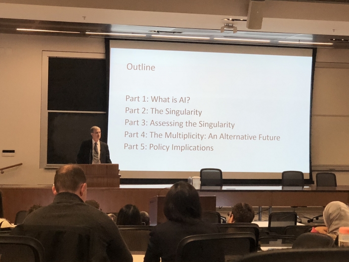 Professor Felten lecturing with info on screen behind him