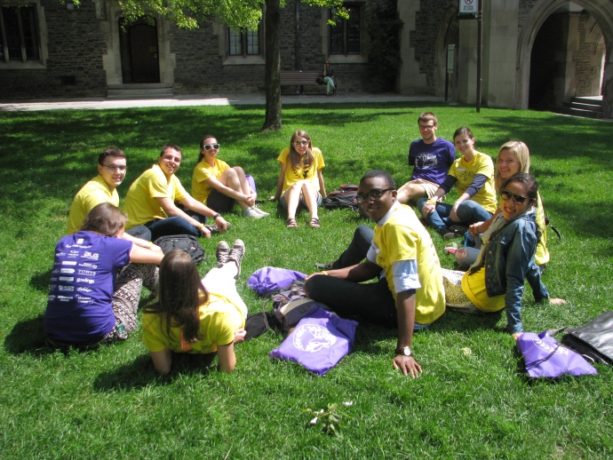 new law students sitting on grass during orientation 2014