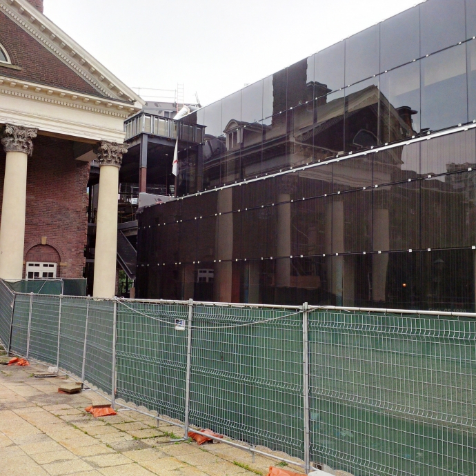 Back of Flavelle House is reflected in new windows of law library