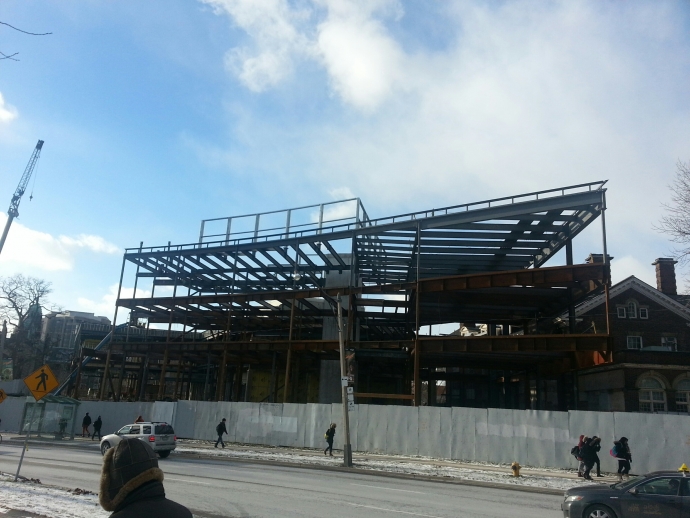 View of west side of Jackman Law Building showing extension of streel framing curving along Queen's Park Crescent