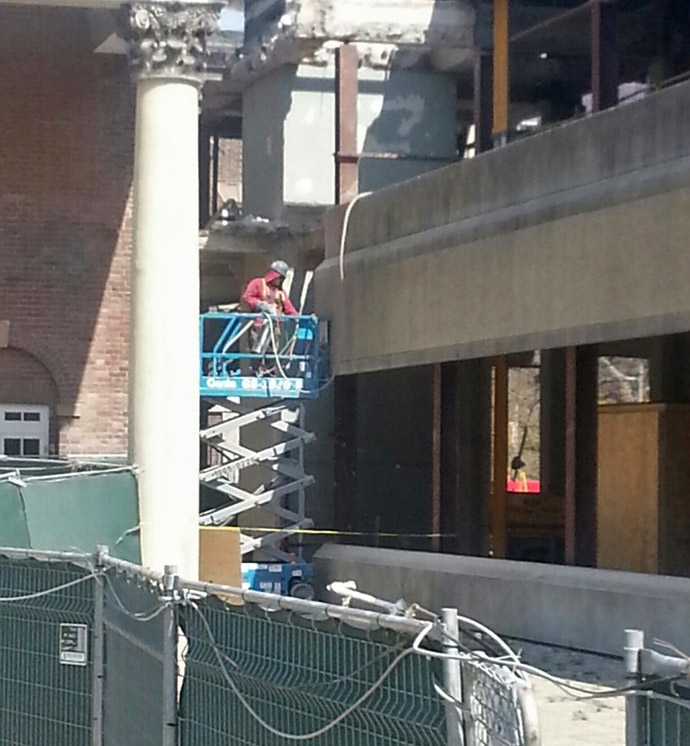 Workers separating Flavelle House from the library building